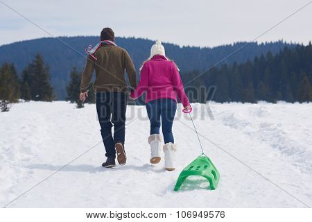 romantic winter  scene, happy young couple having fun on fresh show on winter vacatio, mountain nature landscape