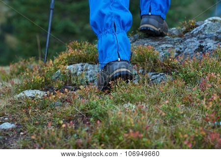 advanture man with backpack hiking on mountain forest