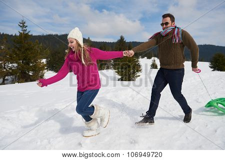 romantic winter  scene, happy young couple having fun on fresh show on winter vacatio, mountain nature landscape