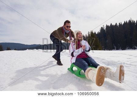 romantic winter  scene, happy young couple having fun on fresh show on winter vacatio, mountain nature landscape