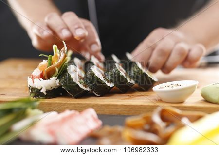 Sushi master preparing sushi in Japanese restaurant