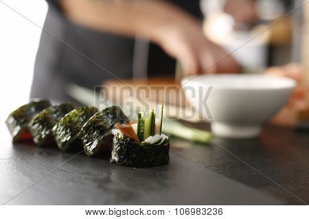 Classic thick rolls futomaki served on a stone plate