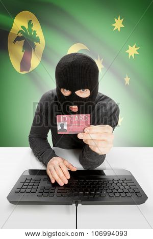 Hacker With Flag On Background Holding Id Card In Hand - Cocos (keeling) Islands