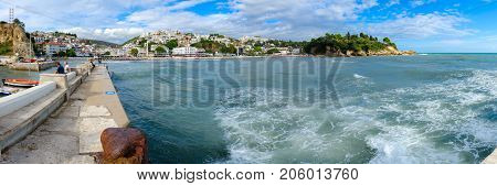ULCINJ MONTENEGRO - SEPTEMBER 9 2017: Beautiful panoramic view of seafront Ulcinj Montenegro. Unknown people are on embankment