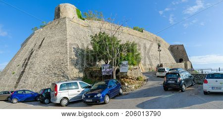 ULCINJ MONTENEGRO - SEPTEMBER 9 2017: Cars at ancient stone walls of Old Town Ulcinj Montenegro