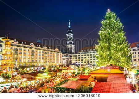 DRESDEN SAXONY / GERMANY - 17 DECEMBER 2016: People visit Christmas Market Striezelmarkt in Dresden Germany. Christmas fair European traditions.