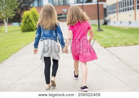 The Great Portrait Of School Pupil Outside Classroom Carrying Bags