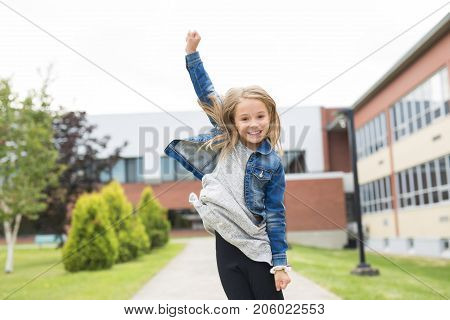 The Great Portrait Of School Pupil Outside Classroom Carrying Bags