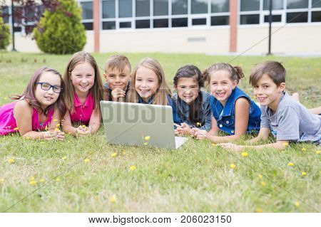 The Great Portrait Of School Pupil Outside Classroom Carrying Bags
