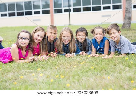 The Great Portrait Of School Pupil Outside Classroom Carrying Bags