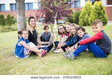 The Great Portrait Of School Pupil Outside Classroom Carrying Bags