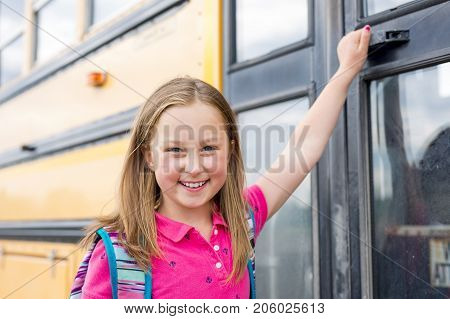 The Great Portrait Of School Pupil Outside Classroom Carrying Bags