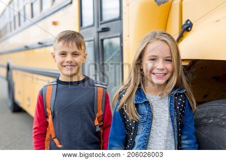 The Great Portrait Of School Pupil Outside Classroom Carrying Bags
