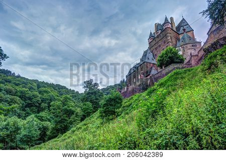 Eltz Castle in Rhineland-Palatinate, Germany. Beautiful landscape with medieval architecture.