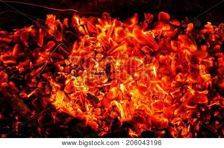 background of burning coals . Photo of an abstract texture