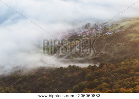 Lizarraga village round by fog and forest