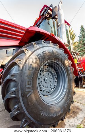 Russia Samara - September 23 2017: Big wheel of new modern agricultural tractor Kirovets K 4 exhibited at the annual Volga agro-industrial exhibition