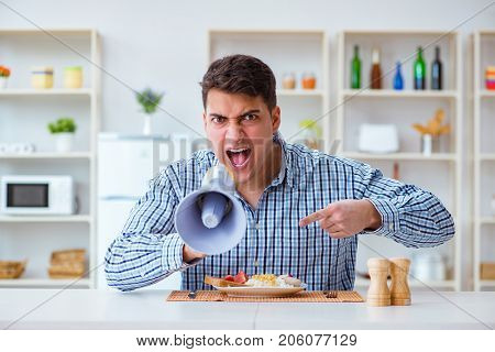 Husband with loudspeaker yelling at his wife