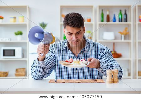 Husband with loudspeaker yelling at his wife