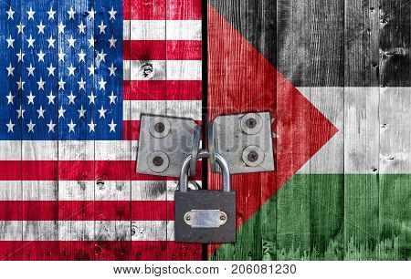 US and Jordan flag on door with padlock