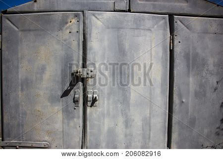 Old prefabricated metal doors of metal garage