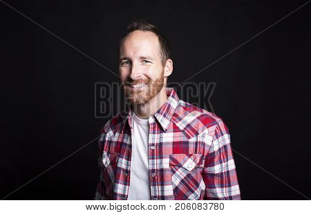 A Portrait of a young successful man over black background