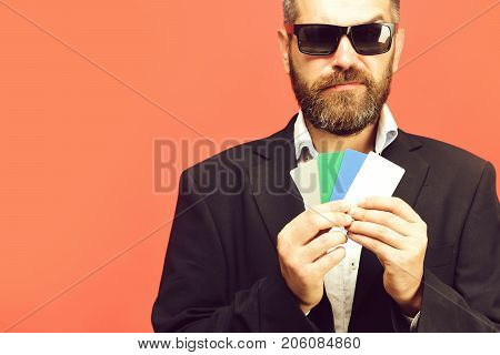 Business And Luck Concept. Guy With Tricky Face And Sunglasses