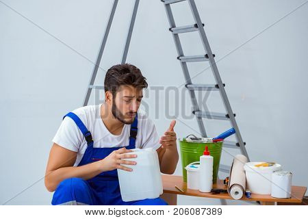 Repairman doing renovation repair in the house with paper wallpa