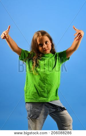 Girl With Confident Face On Blue Background