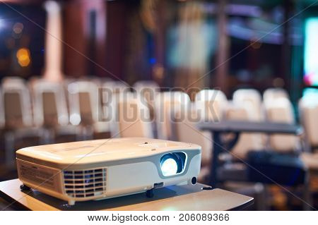 Working projector at the empty conference hall