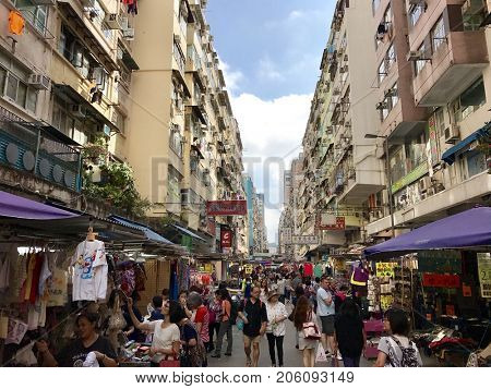 HONG KONG - OCTOBER 25, 2016: Pedestrians walking and shopping in the Ladies Market on Tung Choi Street in Mong Kok, Kowloon, Hong Kong.