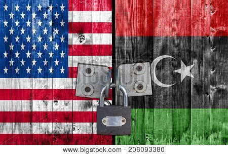 US and Libya flag on door with padlock