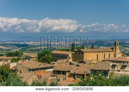 View On Tuscany Landscape Over The Roofs Of Small Town