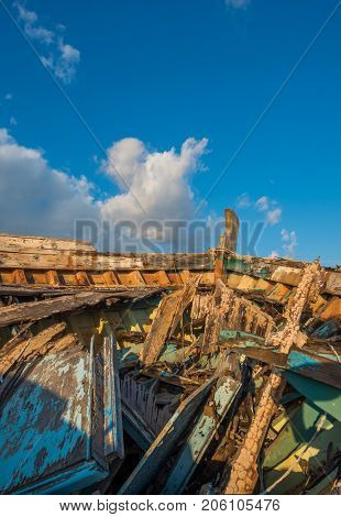 wreck boat on the road at Eleusis Greece