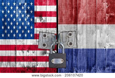 US and Netherland flag on door with padlock