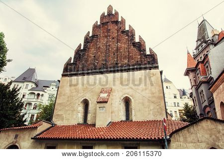 Old new synagogue near High synagogue in Prague Czech republic. Architectural theme. Religious architecture. Retro photo filter.