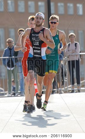 STOCKHOLM - AUG 26 2017: Running triathlete Bob Haller (LUX) followed by competitors in the Men's ITU World Triathlon series event August 26 2017 in Stockholm Sweden