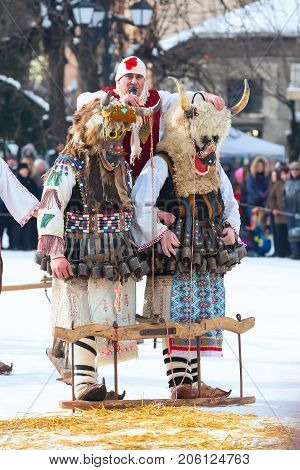 Razlog, Bulgaria - January 14, 2017: People in traditional carnival kuker costumes at Kukeri festival Starchevata