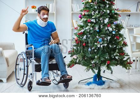 Injured disabled man celebrating christmas at home
