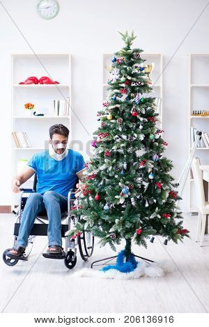 Injured disabled man celebrating christmas at home