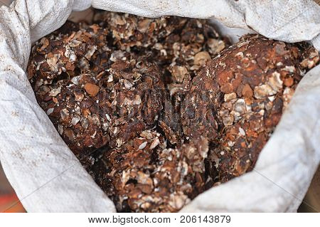 Chocolate cakes in white sack selling on market