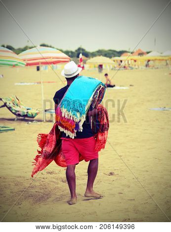 Abusive Walker Walking On The Beach Selling Cotton Fabrics