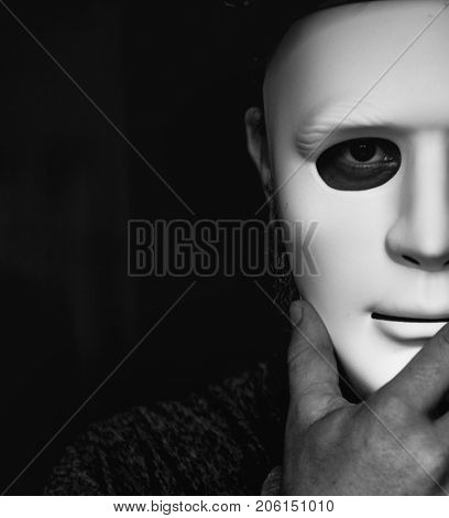 People holding a mask hiding