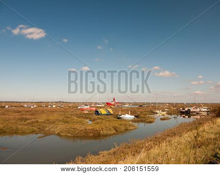 Boats Parked Along Estuary Marshland In Tollesbury Maldon