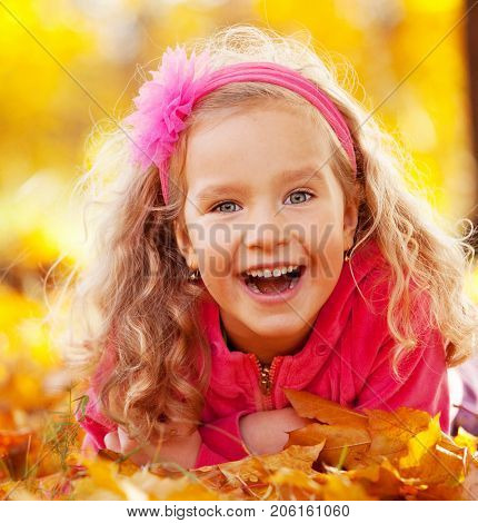 Happy little child in autumn park