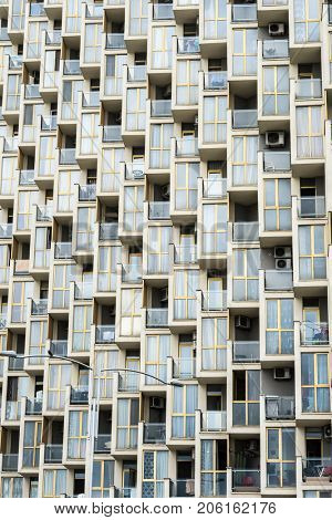 Facade of a big multistorey building with many windows