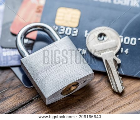 Credit cards and simle mechanical lock. Security concept.