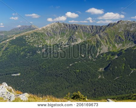 View on mountains peaks Dumbier, Derese and mountain railway station under Chopok in Low Tatra in Slovakia