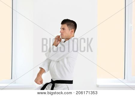 Male karate instructor training in dojo