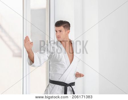 Male karate instructor training in dojo